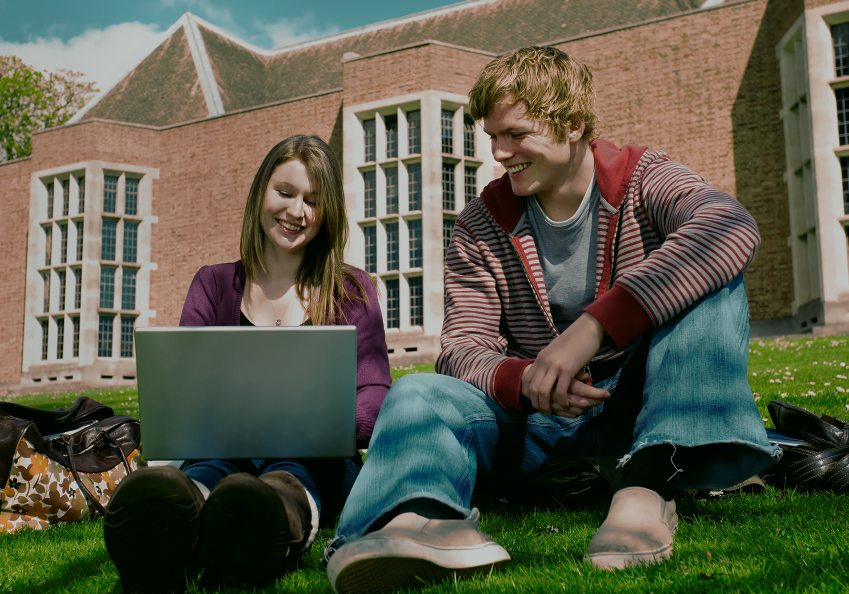 students on college campus lawn mobile